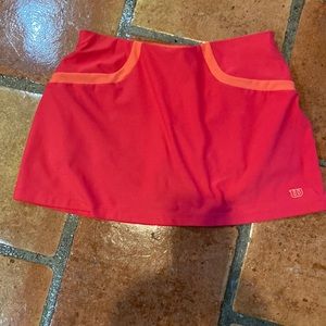 Wilson tennis skirt, pink with orange colored shorts underneath